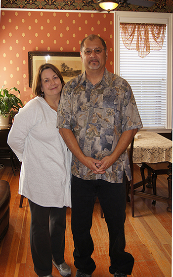 Larry and Marie Estrada in their restored Victorian home